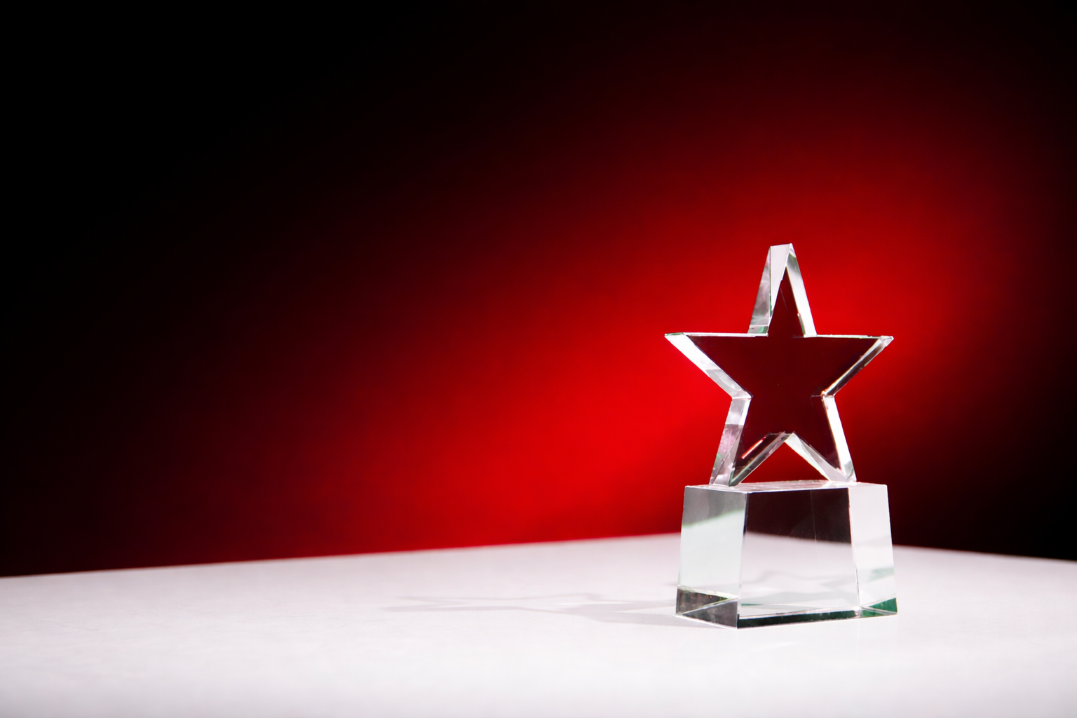 Crystal star award on a red background